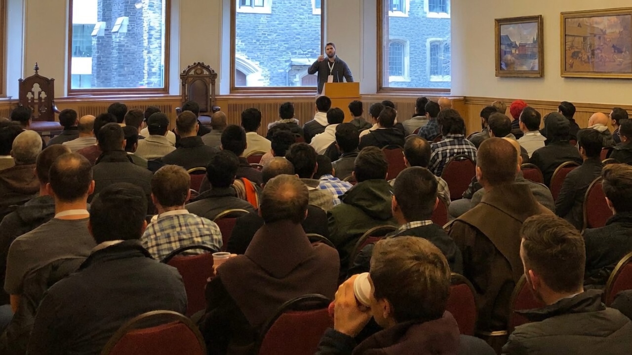 Patrick Sullivan delivering a keynote to a packed hall in Toronto